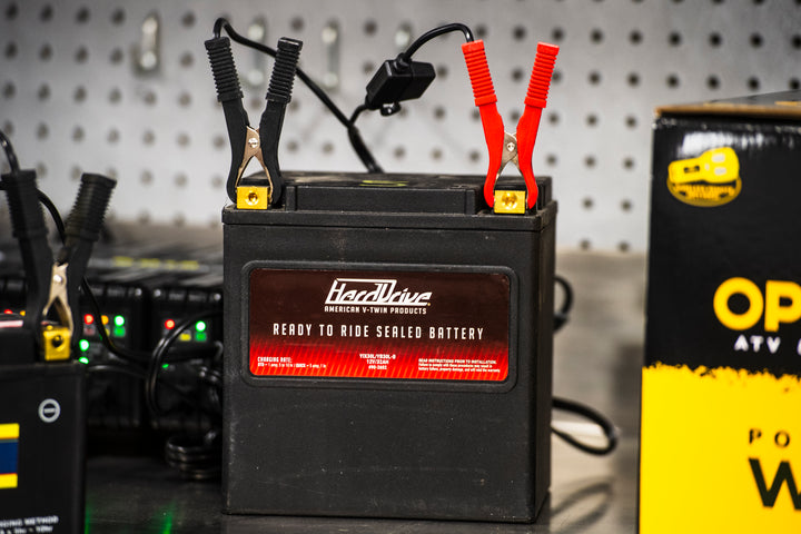 HardDrive battery with jump leads on a workshop background